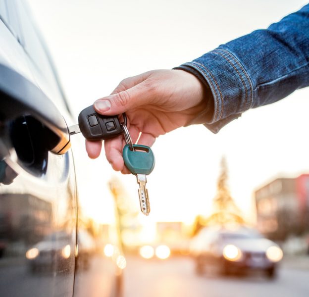 Man Opening A Vehicle With A Car Immobiliser