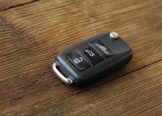 Old Car Key Lock On The Wooden Table — Air Sound & Vision in Bungalow, QLD